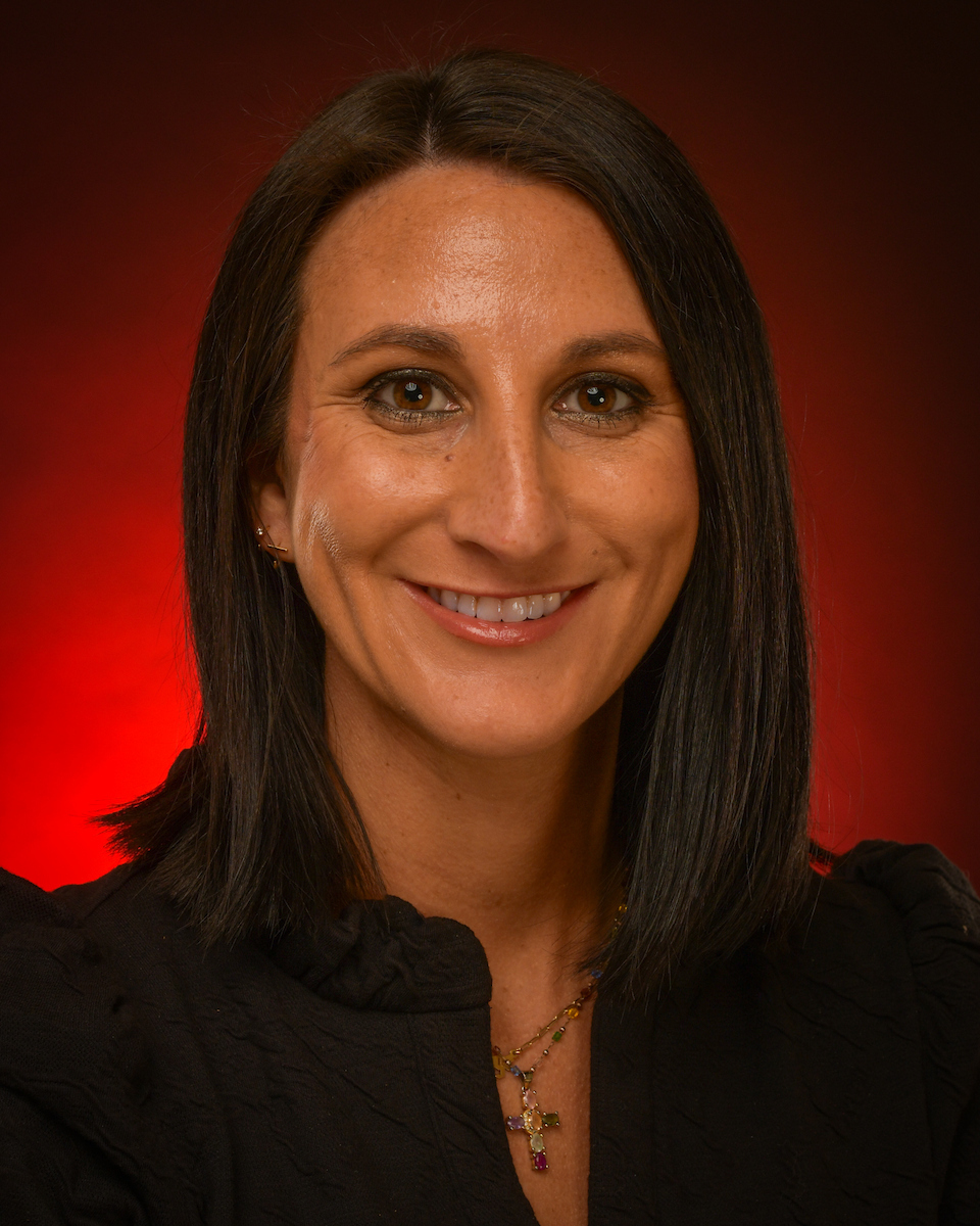 Dr. Katie Knox headshot with red background