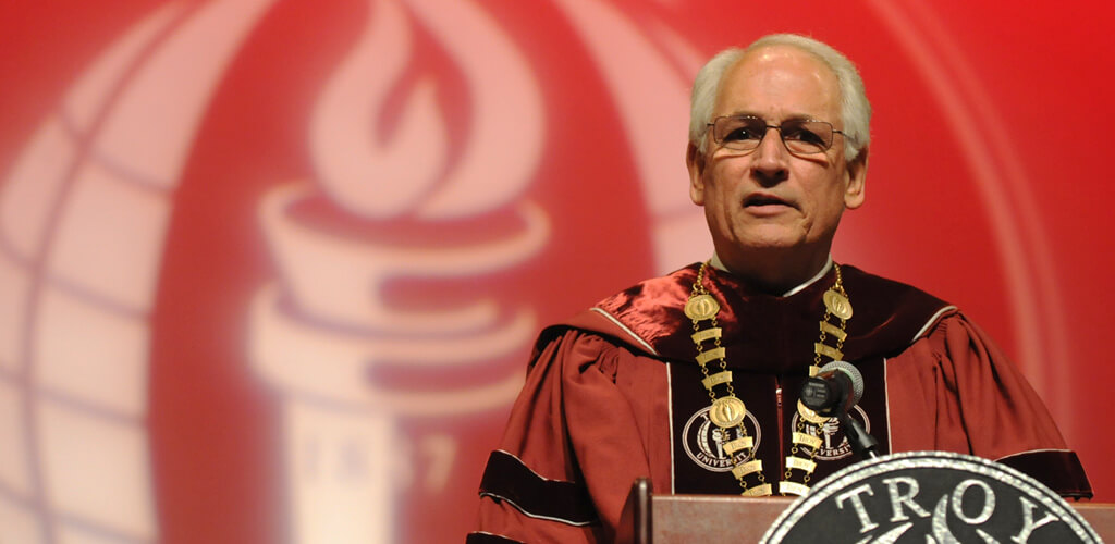 Chancellor Hawkins speaking behind a podium