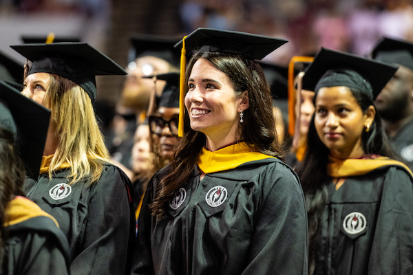 student receiving her degree at commence