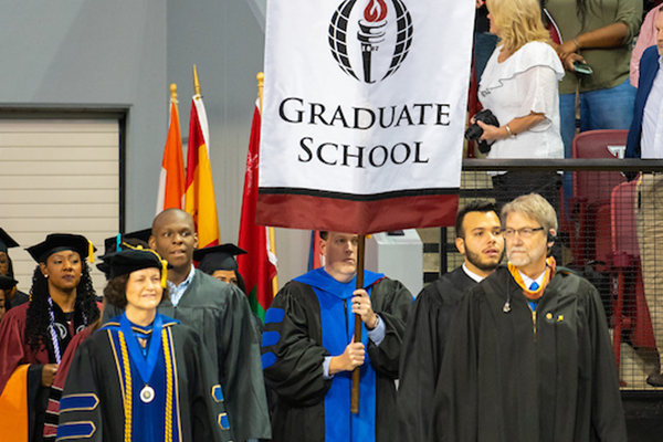 Graduate School flag at graduation