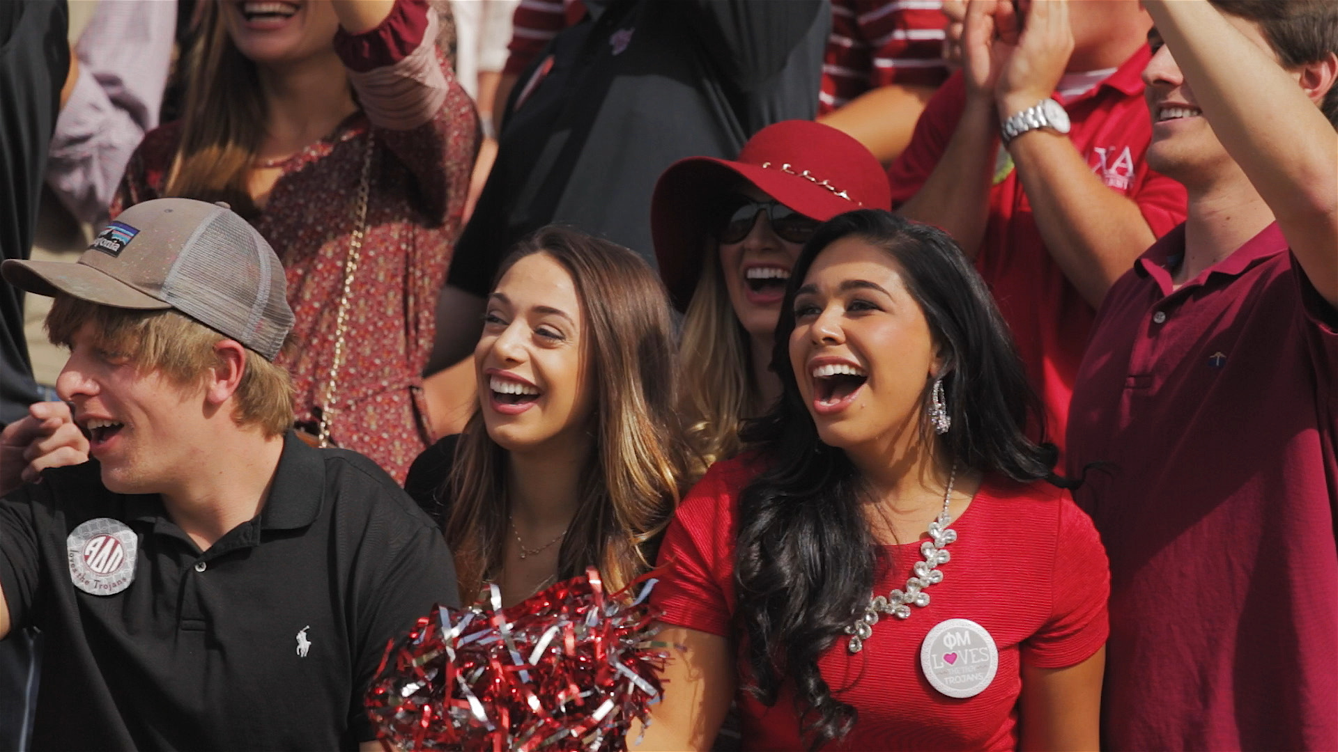 TROY students cheering at a football game.