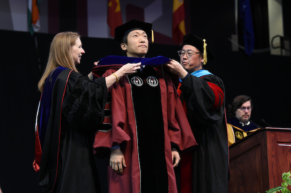 Doctorate Graduate being Hooded at commencement