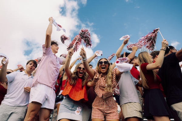 TROY students cheering on Trojan Athletes at a game