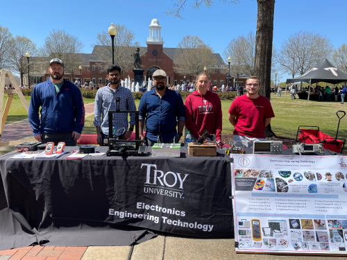 EET faculty and student participating in spring trojan day