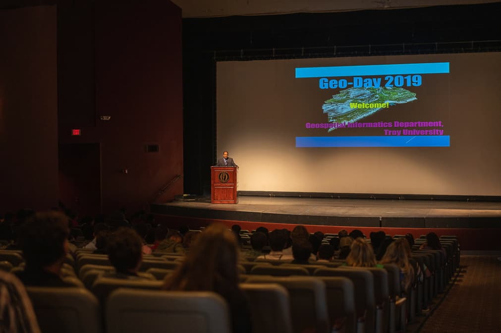 Troy Program director addresses students in opening session of Geo Day 2019 in auditorium