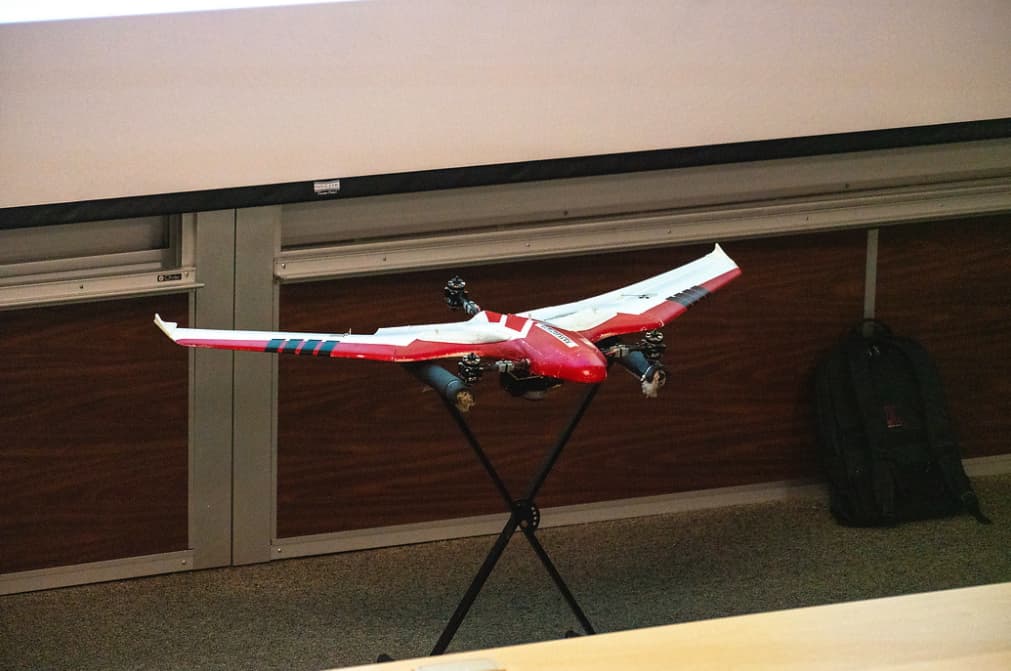 Fixed wing drone with camera on display at a Geo Day session