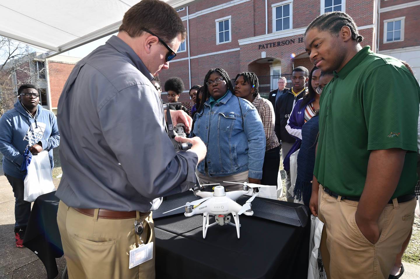 students look at drones