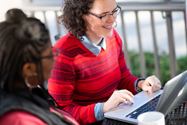 TROY student working on a computer