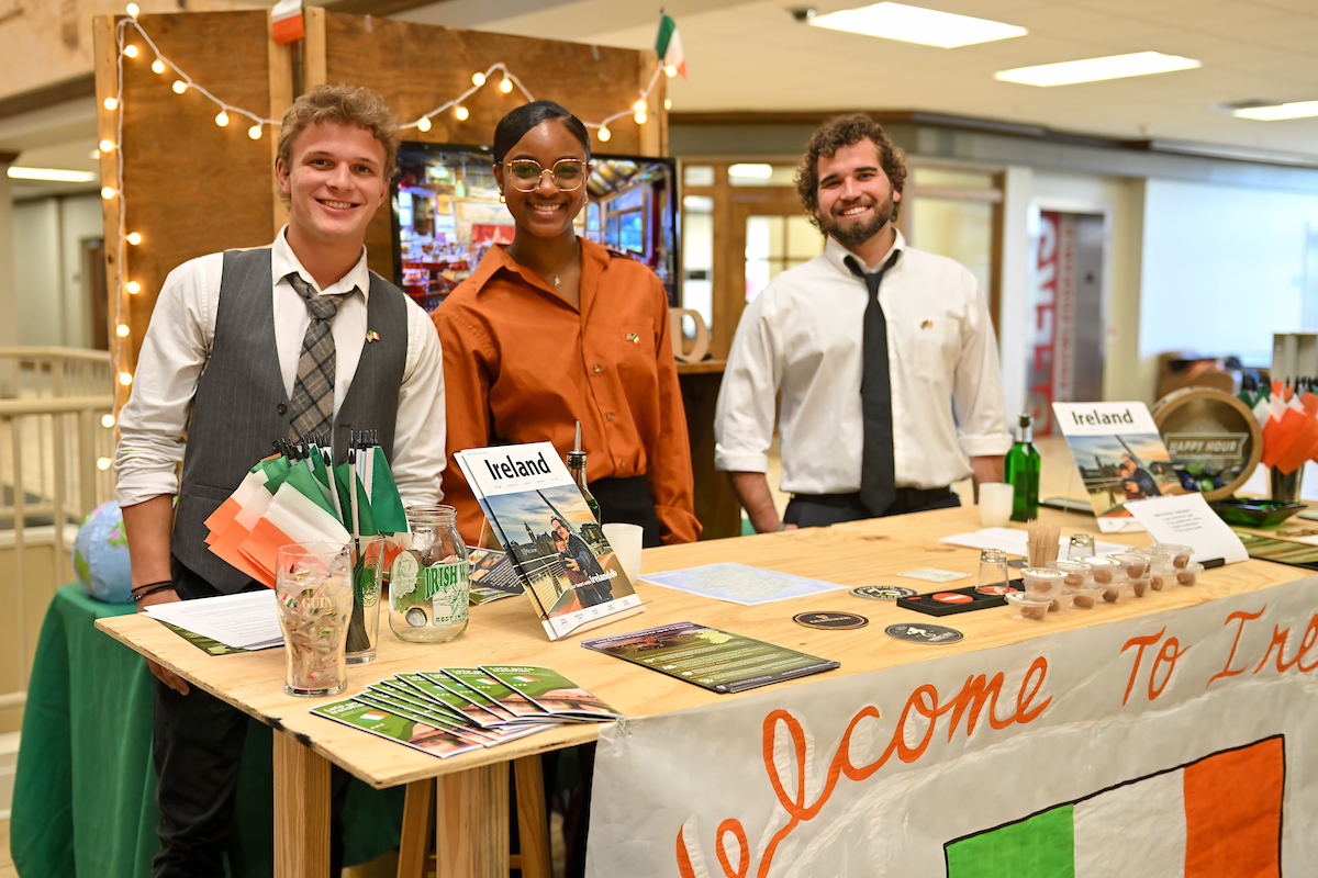 global business students at international trade show