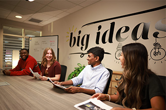 Students in the conference space utilizing their membership.
