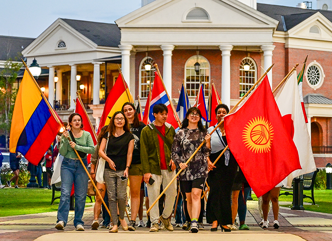 Students with flgs from around the world