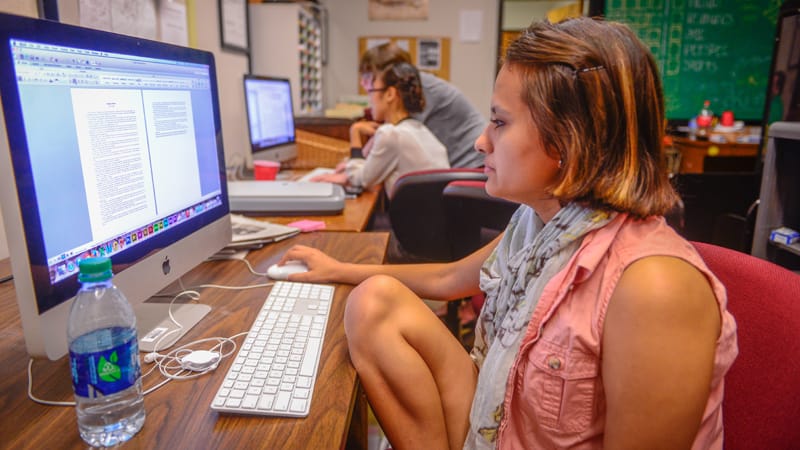 Student, Grishma Rimal, works on a story for the Tropolitan.