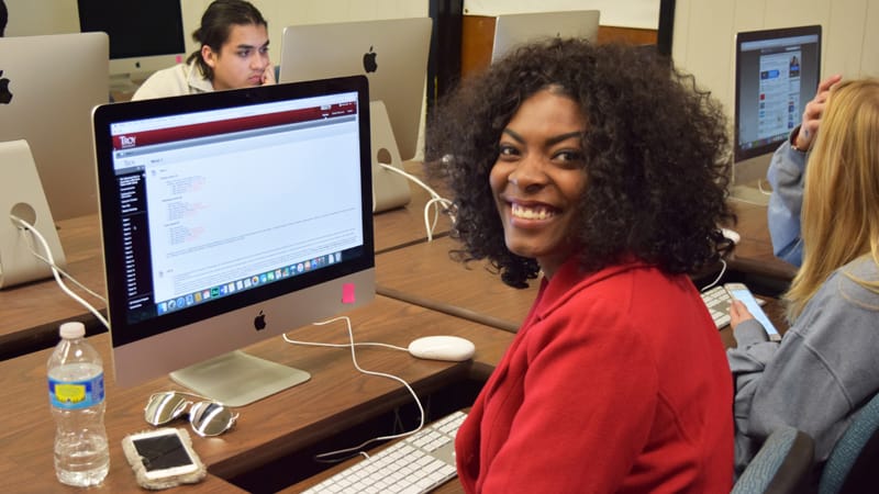 Student works on an assignment in a journalism class.