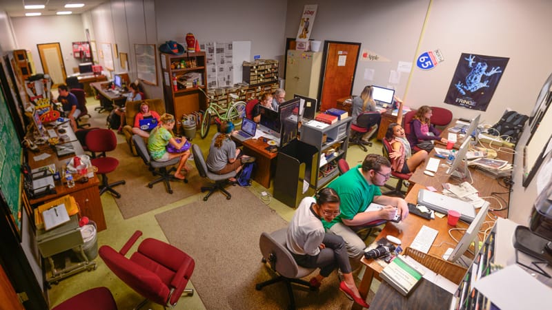 Student reporters work on the latest edition of the Tropolitan.