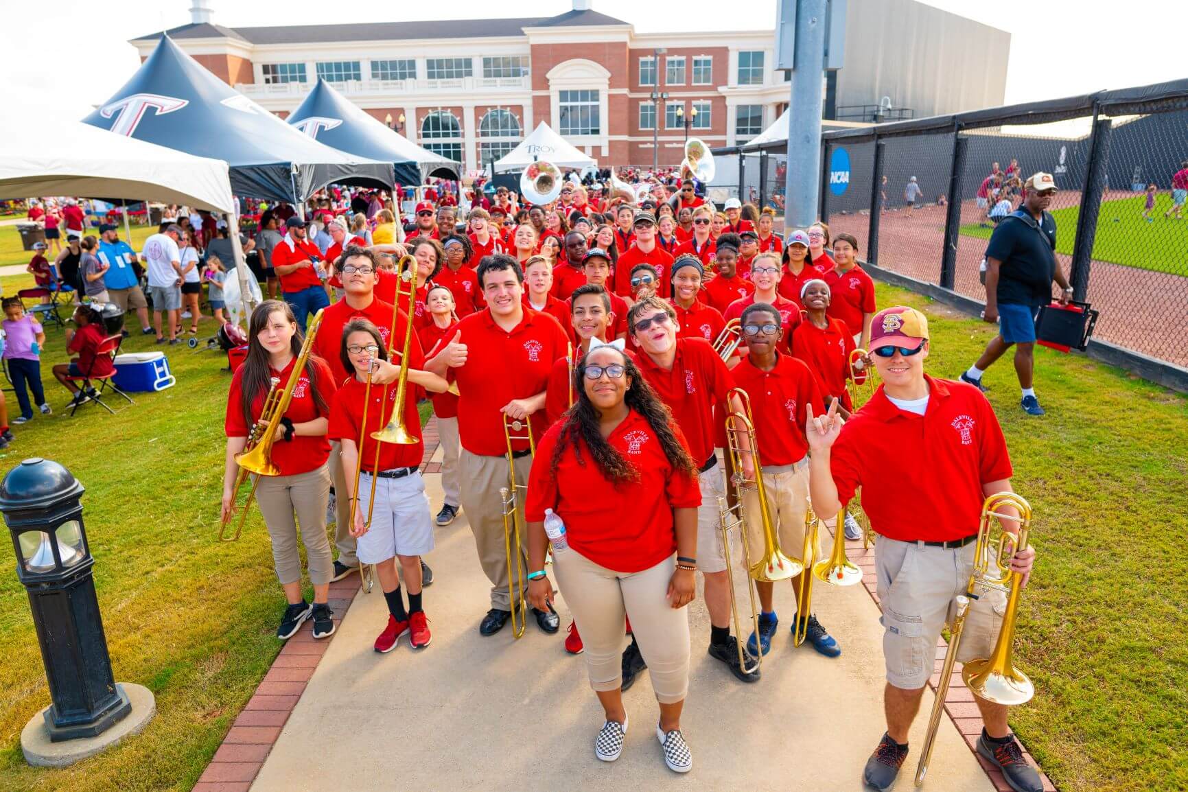 High School Students Walking with Instruments at Band Day 