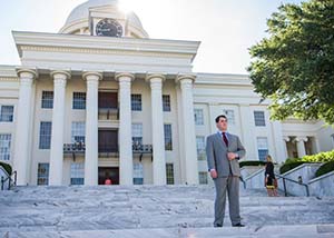TROY alum stands on Alabama State Capitol steps in Montgomery, Alabama