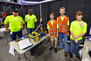 Team members behind the scenes in the pit.