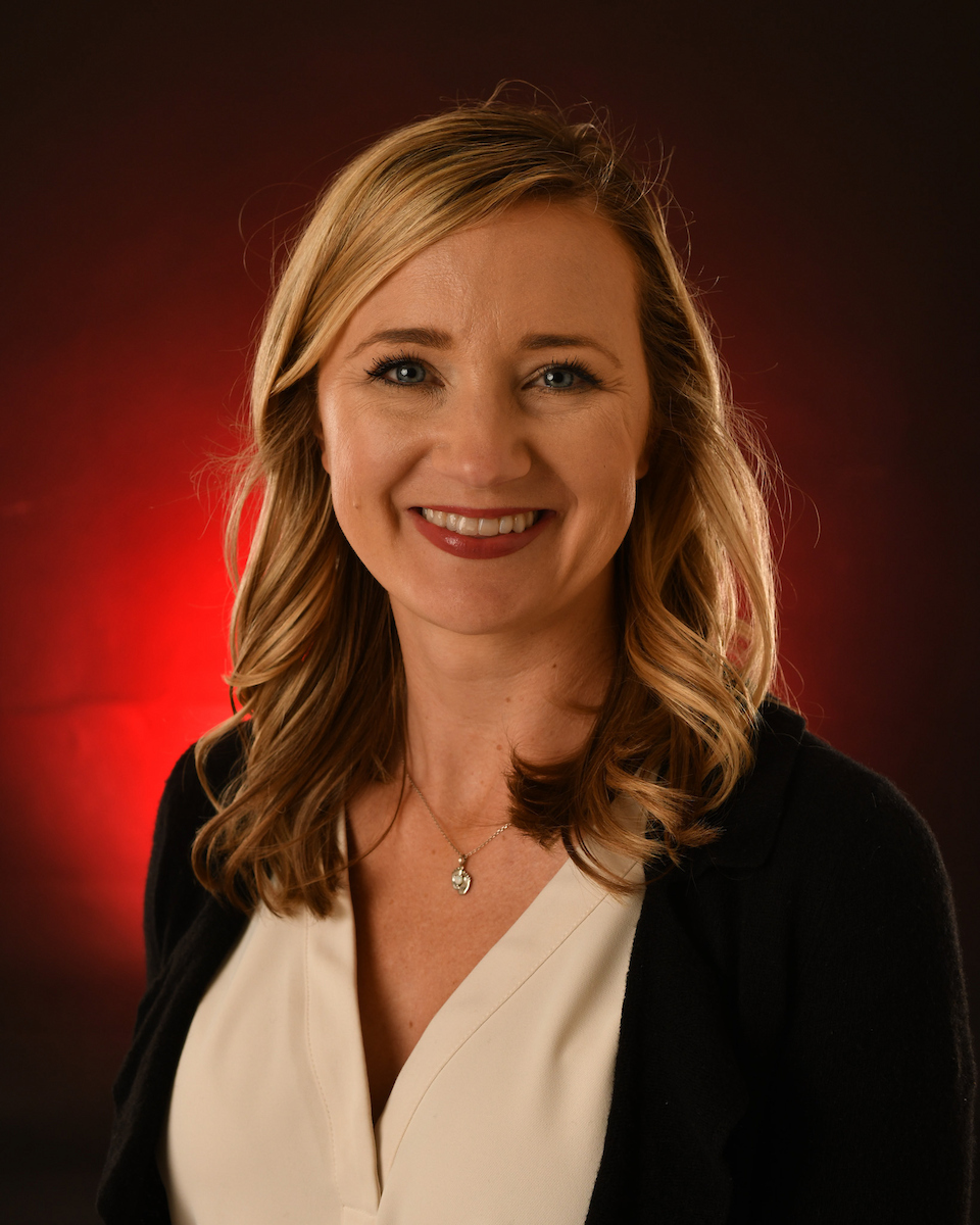 Aubree McKnight in front of red background