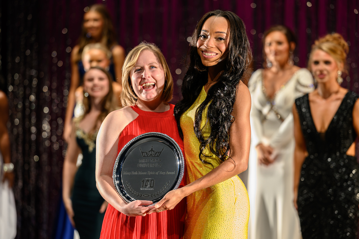Taliyah Speights receiving the Mary Beth Moore Spirit of TROY Award from Mary Beth Moore