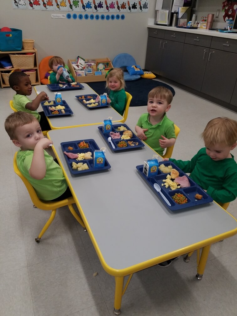 Our toddlers enjoying a hot, nutritious meal.