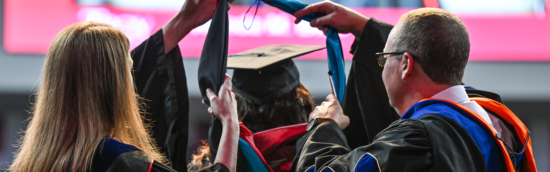 TROY student being hooded at commencement ceremony