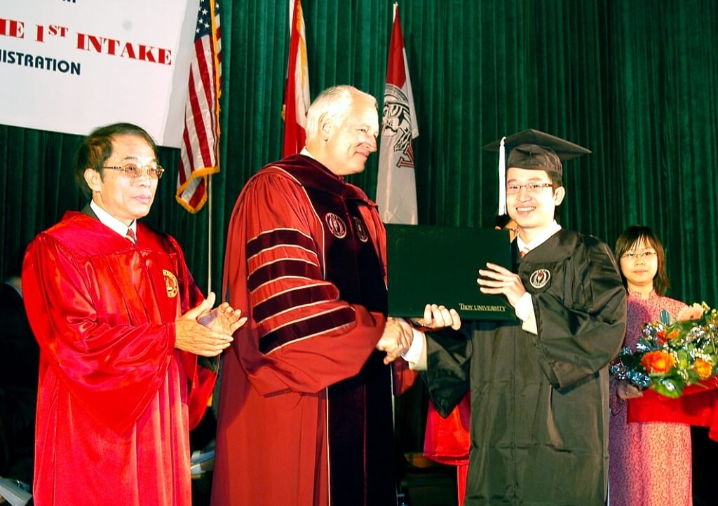 Chancellor Hawkins presents the first American undergraduate degree in Vietnam.