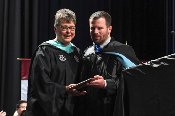 Teresa Penn Rodgers Excellence in Student Advising Award winner Tamara Jones, pictured with Jonathan Cellon