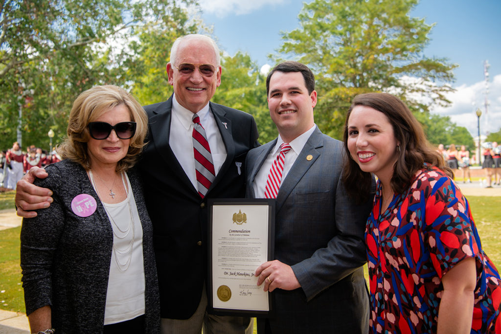 William and Liz Filmore, TROY alumni and members of Gov. Kay Ivey’s staff, present Dr. and Mrs. Jack Hawkins, Jr. with a resolution honoring Dr. Hawkins’ 30th year as the University’s Chancellor.