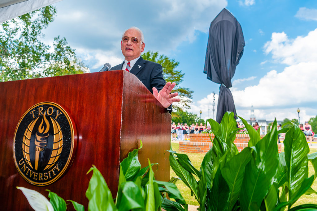 Dr. Jack Hawkins, Jr. speaks to the crowd at the dedication of the clock during a ceremony honoring his 30 years of service as chancellor.