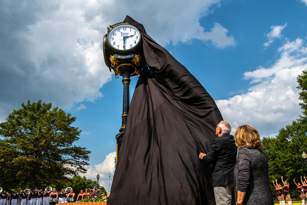 Dr. Jack Hawkins, Jr. unveils the clock.