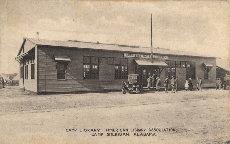 Black and white photograph of a one-story building that served as the Camp Sheridan Free Library. Postmarked November 17, 1918.