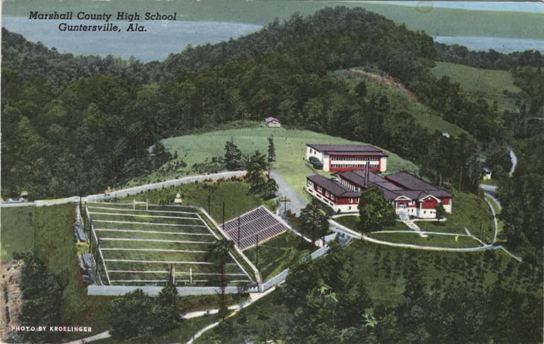 Color print of Marshall County High School buildings and soccer field in Guntersville, Alabama.