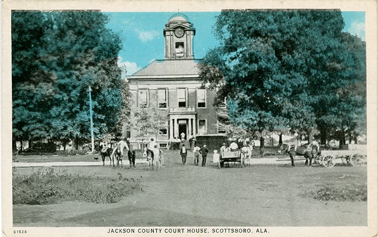 Mostly black and white print of the Jackson County Courthouse in Scottsboro, Alabama.