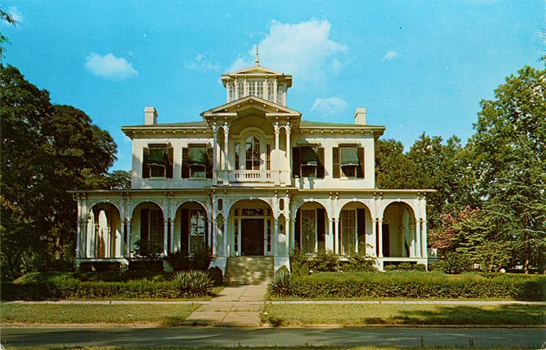 Color photograph of the two-story Burchfield Home in Tuscaloosa, Alabama which became the Friedman Library.