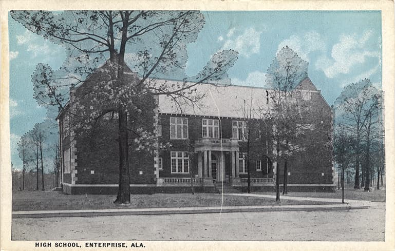 Mostly black and white print of the two-story Enterprise High School in Enterprise, Alabama.