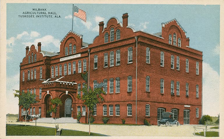 Color print of the multi-story Milbank Agricultural Hall on the campus of Tuskegee Institute.