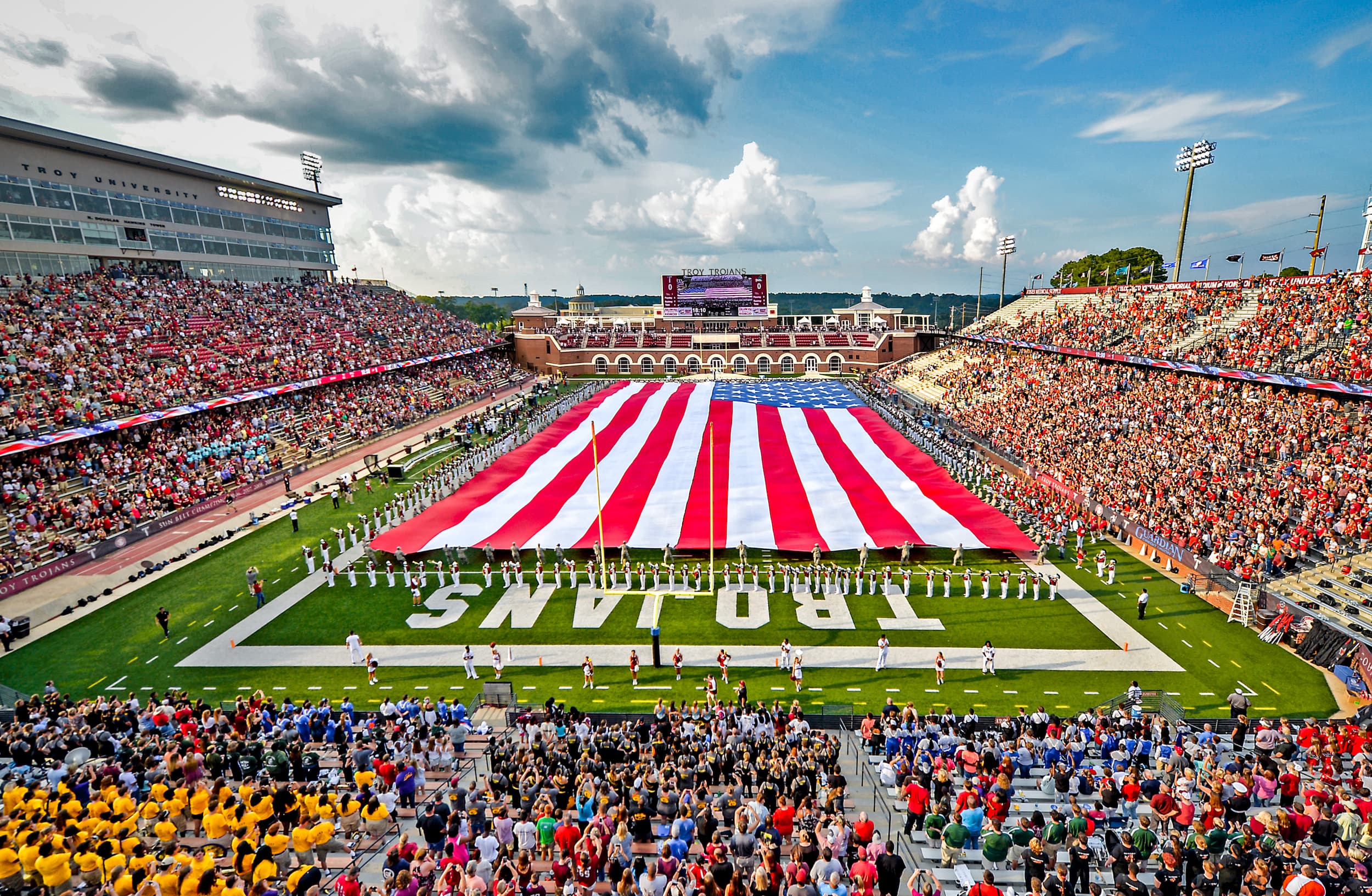 The American Flag covering the field at Veteran Memorial stadium during a TROY football game. 