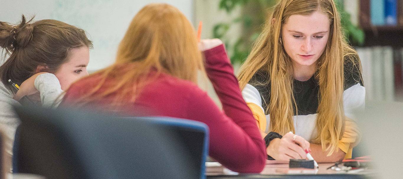 students studying at a table