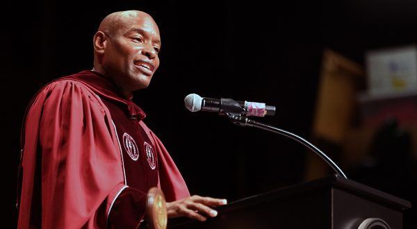 Eric Sloan, two-time TROY graduate, delivers the December 2024 commencement address to graduates at TROY's Montgomery Campus.