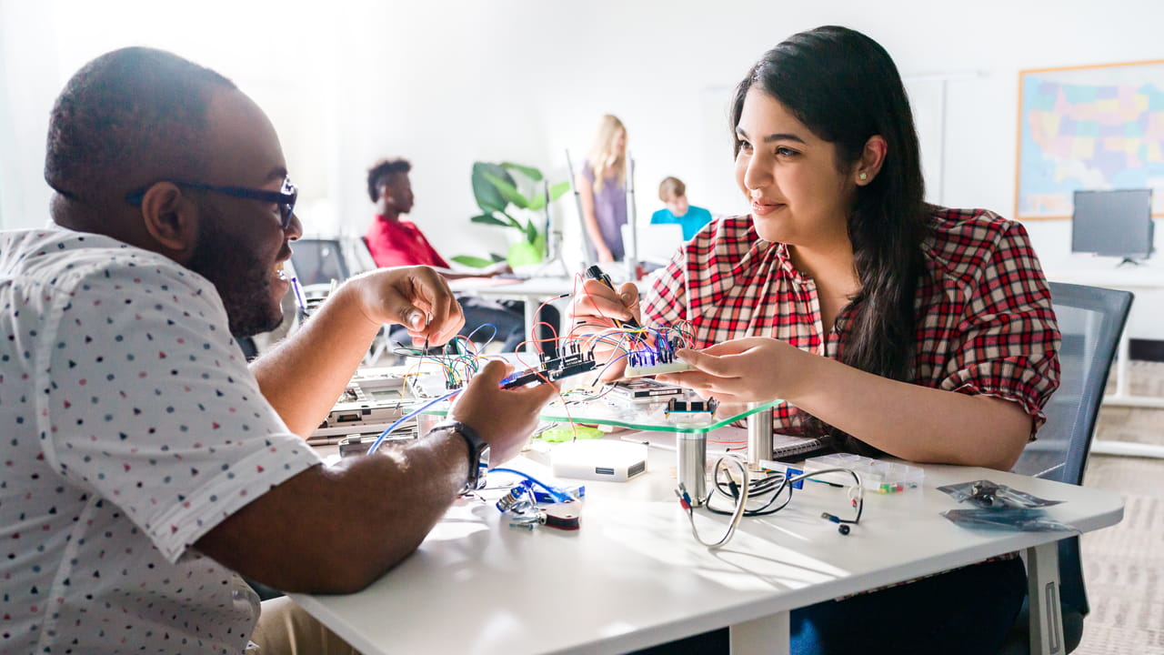 Students working on electronics.