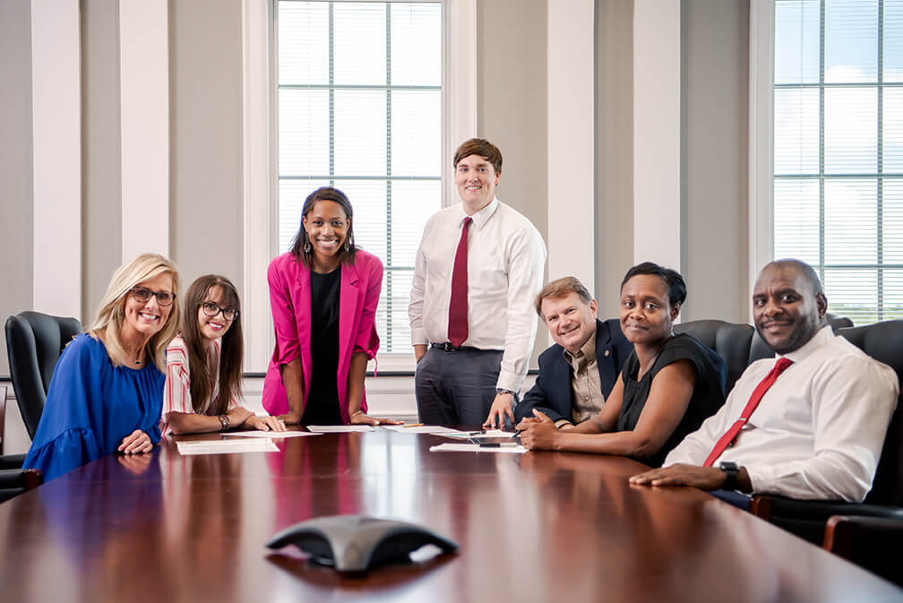 Employees in a board room.