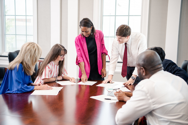 Photo of Doctorate students in a Conference room, Alabama campus.