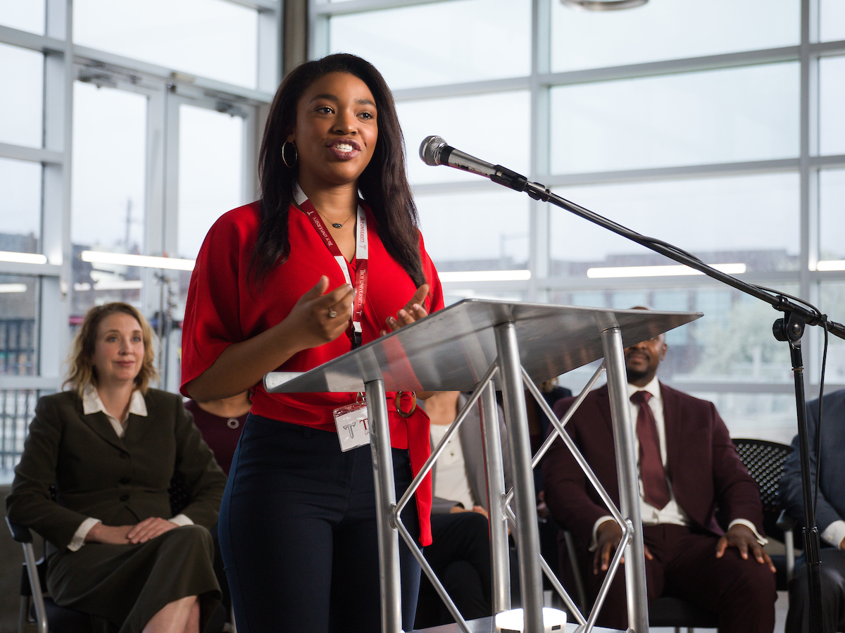 student speaking at conference