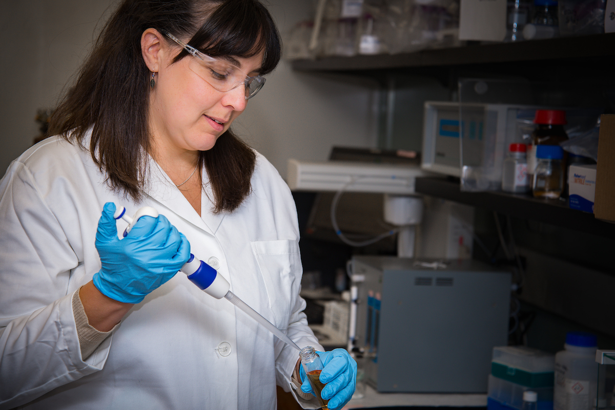 Troy University student working in lab