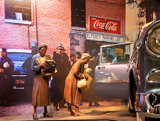Image from the museum of lady's getting into a car during that time period