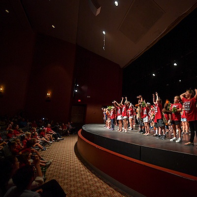 Students performing on stage. 