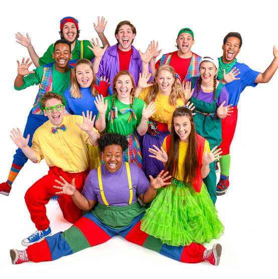 Group photo of members of the Pied Pipers wearing colorful clothing.