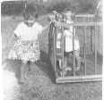 [1948]  Valerie Simmons with her niece, Linda Simmons, in playpen.