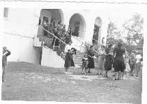 Headland Avenue Baptist Church, Dothan, AL.  Marjorie Simmons in white blouse carrying jacket over her arm.