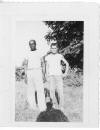 Willadean Martin Hall's father, Willie Gene Martin, (with unidentified worker), migrant orange harvesting possibly in Florida.